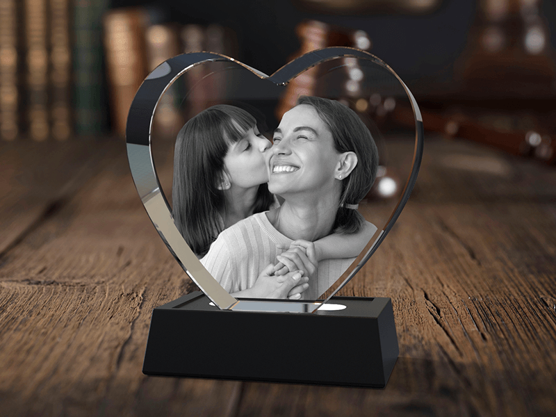 3D photo crystal heart on a wooden desk