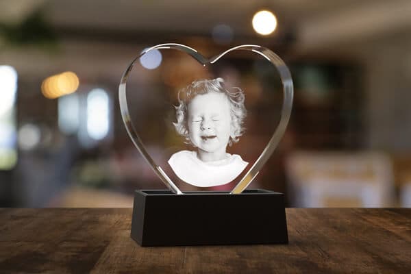 Adorable baby engraved in a 3D photo crystal with a wooden light base.